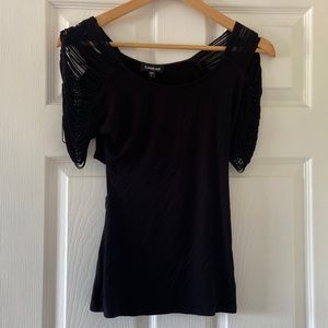 Black Bebe top with draped black open sleeves.